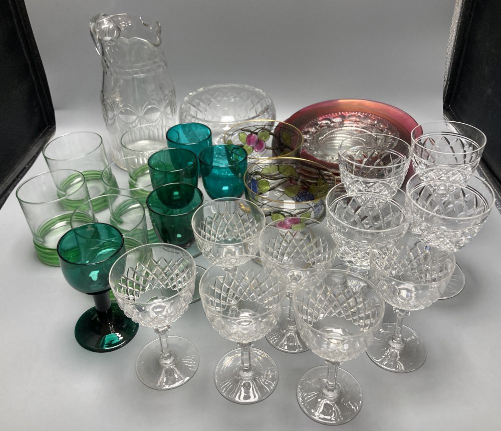 A collection of clear and coloured glassware, including four green bowled wines, vine etched cranberry tumblers, dessert bowls etc.